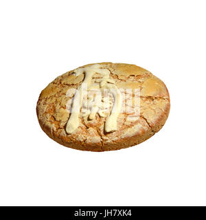 Bannock. Traditional bread with the Cyrillic letter and The Serbian cross written with dough on its upper side. Isolated on white. Stock Photo