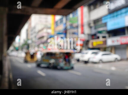 Defocused cars in city traffic jam in a rainy day. Metro Manila, Philippines. Stock Photo