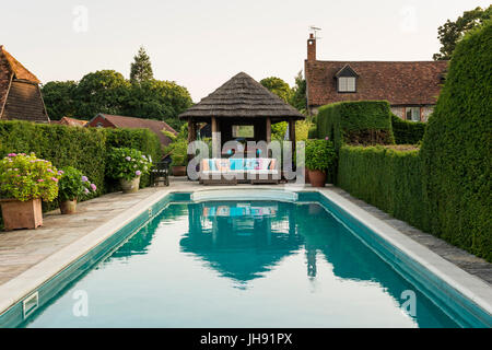 Gazebo by swimming pool Stock Photo