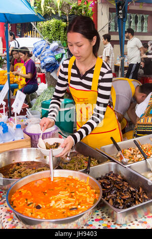 Serving vegetarian food at the Vegetarian Festival in Chinatown, Bangkok, Thailand Stock Photo