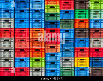 colorful plastic boxes stacked one upon the other Stock Photo