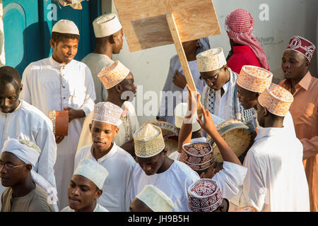 Procession (Zefe) along the streets of Lamu old town to celebrate Maulidi festival, the birth of the prophet Mohammed, Lamu island, Kenya Stock Photo