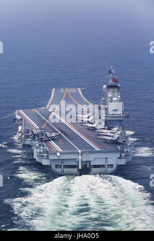 Aboard Liaoning Aircraft Carrier. 13th July, 2017. China's aircraft carrier Liaoning is seen during a new training mission upon arrival at an unidentified sea area, July 13, 2017. Chinese aircraft carrier formation conducted coordination training on Thursday. Credit: Zeng Tao/Xinhua/Alamy Live News Stock Photo