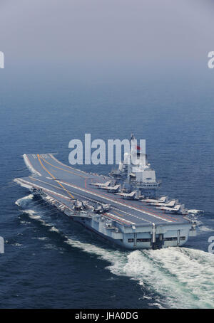 Aboard Liaoning Aircraft Carrier. 13th July, 2017. China's aircraft carrier Liaoning is seen during a new training mission upon arrival at an unidentified sea area, July 13, 2017. Chinese aircraft carrier formation conducted coordination training on Thursday. Credit: Zeng Tao/Xinhua/Alamy Live News Stock Photo