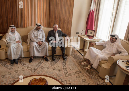 U.S. Secretary of State Rex Tillerson, center, during a meeting with the Emir of Qatar, Sheikh Tamim Bin Hamad Al Thani, right, at the Sea Palace July 11, 2017 in Doha, Qatar. Tillerson is meeting leaders of the Gulf Cooperation Council in an attempt to end the isolation of fellow member Qatar by a Saudi led coalition. Stock Photo