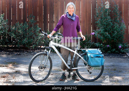 Napa, CA, USA. 5th June, 2017. Napan Donna Risinger poses with the bicycle she has been training on recently. She has shipped the bicycle that she will ride cross-country to Bar Harbor, Maine and will meet a friend where they will begin a 4,200-mile trek that will finish in Anacortes, Washington in about three months. Credit: Napa Valley Register/ZUMA Wire/Alamy Live News Stock Photo