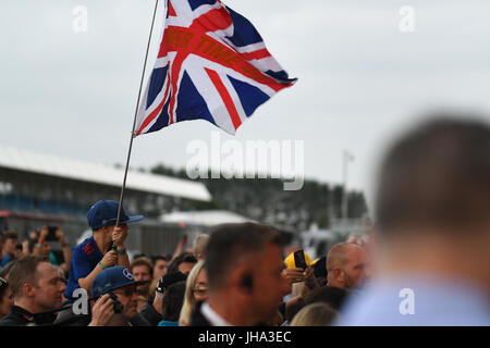 F1 British Grand Prix. Silverstone Race Circuit, UK. Thursday 13 July 2017. Fans, including this young Lewis Hamilton fan, gather to see the drivers at the Formula 1 British Grand Prix. Credit: KEVIN BENNETT/Alamy Live News Stock Photo