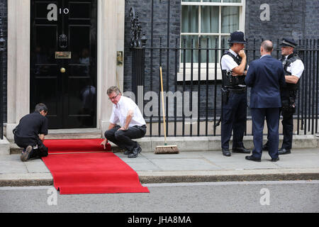 Downing Street. London, UK. 13th July, 2017. Workers prepare the red carpet ahead of His Majesty King Felipe VI of Spain's arrives in Downing Street on the second day of the Spanish Royals three day state visit to the UK Credit: Dinendra Haria/Alamy Live News Stock Photo