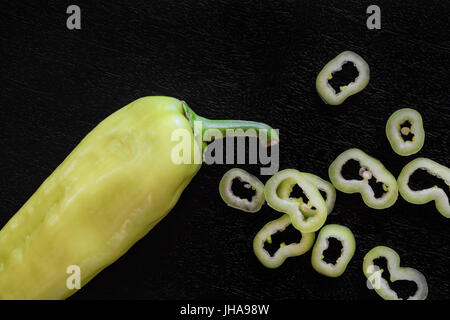 Fresh green pepper on black wooden background Stock Photo