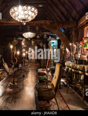 Chandeliers in rustic dining room Stock Photo