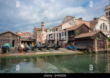 Real Venice, Italy: one of the last gondola boat build and repair shipyard - workshop on a canal in the Dorsoduro area Stock Photo
