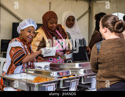 Ladies serving African food at Manx Food & Drink Festival at Willa Marina Stock Photo