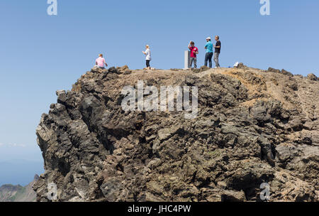Western tourists on volcanic peak of North Korean side of Mount Paekdu. DPRK / North Korea Stock Photo