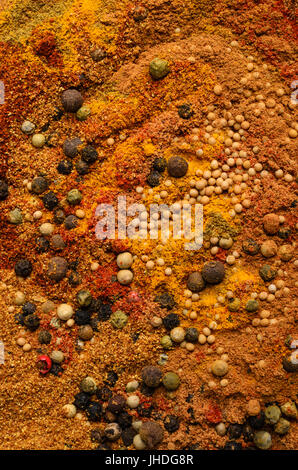 Abstract food texture made from a wide variety of spices in seed and powder form. Stock Photo