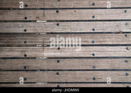 Wooden plank floor with between floorboards rubber - Image for background. Stock Photo