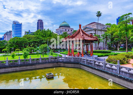 TAIPEI, TAIWAN - JUNE 20: This is a view of the 228 memorial peace park with the National Taiwan museum architecture and city buildings in the backgro Stock Photo