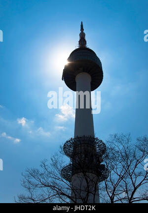view of Seoul Tower from bottom backlit by spring sun Stock Photo