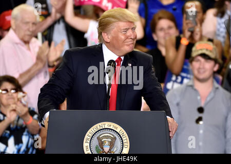 President Donald Trump right face smile during a campaign rally to mark 100 days in office. Held at The Farm Show Complex and Expo Center. Stock Photo