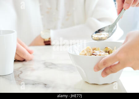 carer bringing meal to senior,meal time. part of senior woman with breakfast, Senior healthy eating Stock Photo