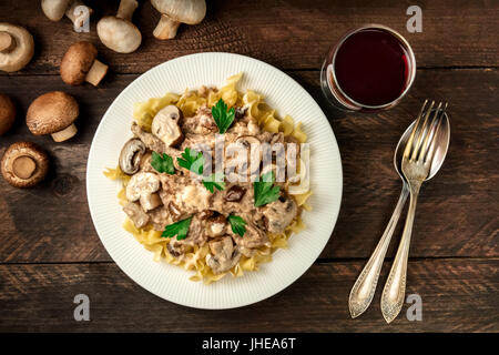 Mushroom beef stroganoff with egg pasta and red wine Stock Photo