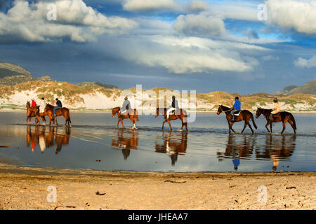Horse riding in Noordhoek beach, Chapman's Peak drive road, Cape town, South Africa. Stock Photo