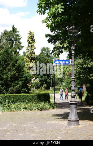 Mainz, Germany - June 10, 2017: The entrance of the City Park Mainz with visitors behind a nostalgic lantern on June 10, 2017 in Mainz. Stock Photo