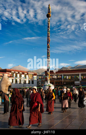 Tibetan buddhist devotees do the Kora clockwise circumambulation around Jokhang temple, Lhasa Tibet Stock Photo