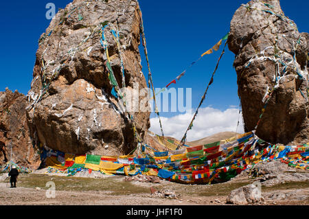 Prayer flags at the Couple Stone, Nam Tso lake, Nyainqentanglha mountains, Tibet Stock Photo