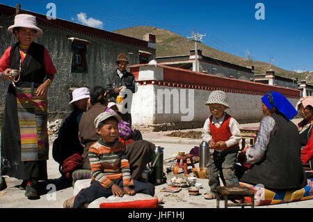 A family celebrates the graduation of a relative in the village of Bainans, located along the road separating Shigatse from Gyantse, Tibet, China. Stock Photo