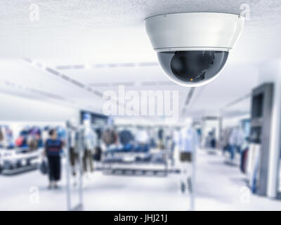 security camera or cctv camera on ceiling with retail shop background Stock Photo