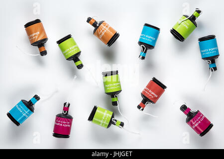 Multicolour Party Poppers from above on white background Stock Photo