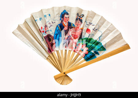 A traditional decorative Chinese paper fan on a white background. Stock Photo