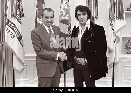 President Nixon shaking hands with entertainer Elvis Presley in the Oval Office of the White House on December 21, 1970. (Photo by Oliver F. Atkins) Stock Photo