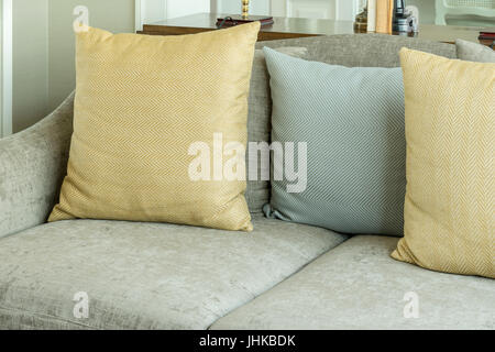 living room interior with yellow and gray pillows on velvet gray sofa Stock Photo