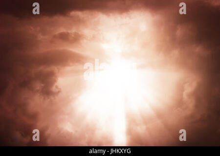Dramatic apocalyptic clouds background with light rays Stock Photo