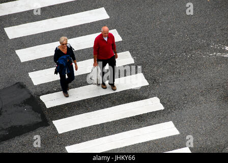 Two people on zebra crossing Stock Photo