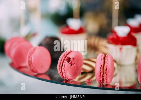 Dessert Sweet Tasty Macarons And Cookies In Candy Bar On Table. Delicious Sweet Buffet. Wedding Decorations Stock Photo