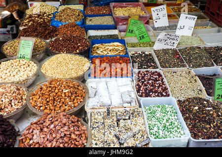 An assortment of nuts, seeds and sweets on display in Carmel Markets, Tel Aviv, Israel. Stock Photo