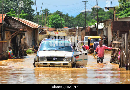 Dimapur, India. 14th July, 2017.  A vehicle passes through flooded street after a heavy rainfall in Dimapur, India north eastern state of Nagaland. The South west monsoon which usually hits the South East Asia region from June till September causes massive flood disaster every year. Credit: Caisii Mao/Alamy Live News Stock Photo