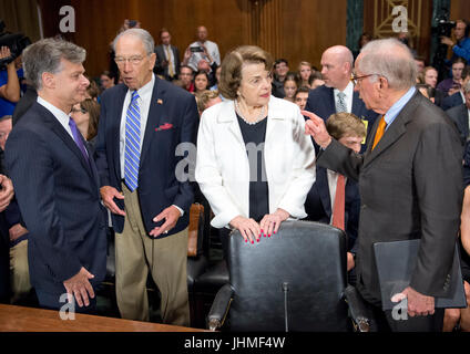 United States Senator Charles Grassley (Republican of Iowa), Chairman, US Senate Committee on the Judiciary, center left, engages in conversation with Christopher A. Wray, left, as US Senator Dianne Feinstein (Democrat of California), Ranking Member, US Senate Committee on the Judiciary, center right, engages in conversation with former US Senator Sam Nunn (Democrat of Georgia), right, prior to Wray giving testimony on his nomination to be Director of the Federal Bureau of Investigation (FBI) before the Committee on Capitol Hill in Washington, DC on Wednesday, July 12, 2017. Credit: Ron Sachs Stock Photo