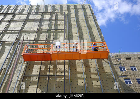 Teams of construction engineers working on the glazing of the new Perinatal Medical Center in Tambov Stock Photo