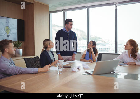 Business partners discussing in meeting at office board room Stock Photo
