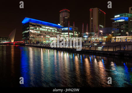 Salford Quays And MediaCityUK BBC Buildings At Night, Manchester, United Kingdom Stock Photo