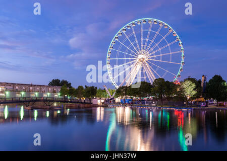 Montreal, Canada - 13 July 2017: The Montreal Observation Wheel (Grande Roue de Montreal) in the Old Port of Montreal at night Stock Photo