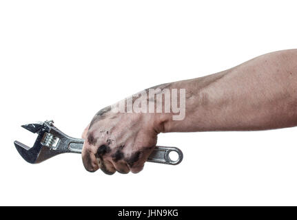 Oily hands of mechanic holding a wrench. Isolated background. Stock Photo