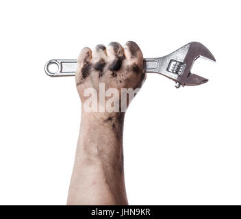 Oily hands of mechanic holding a wrench. Isolated background. Stock Photo