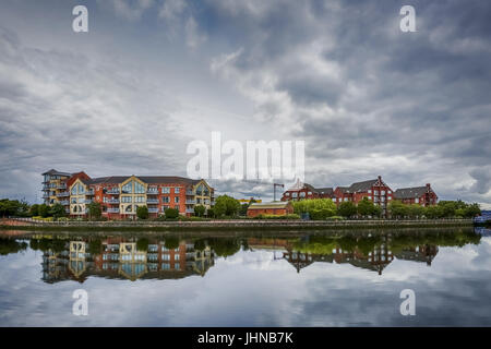 dramatic sky over modern architecture along river Lagan in Belfast, Northern Ireland Stock Photo