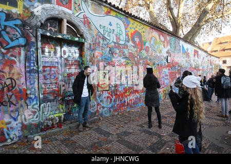 The John Lennon wall is graffiti filled wall in Prague, the Czech Republic. the wall represents a symbol of global ideals such as love and peace. Stock Photo