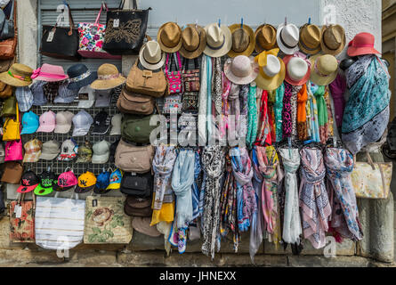 Shop display of colourful scarves, hats and bags Stock Photo