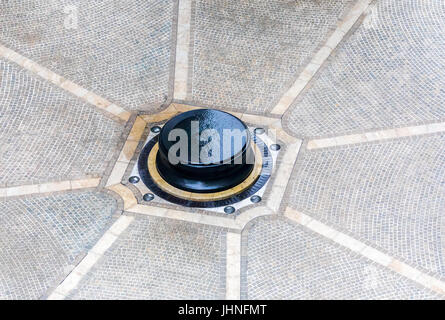 an amazing round elevated fountain surrounded by cobblestone in the entry of an ultra expensive builiding on the upper west side of manhattan Stock Photo